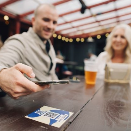 Scan a QR code on the table, place your order and pay.
